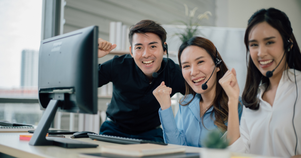 Happy call center agents after being approved for personal loans